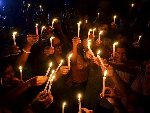 People hold a candlelight vigil to protest against the RG Kar Medical College & Hospital rape-murder in Kolkata