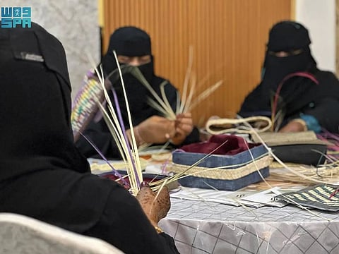 Saudi women make wicker products in Najran in south-western Saudi Arabia.
