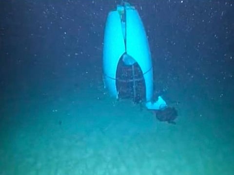 In this June 22, 2023, image obtained from the US Coast Guard and Pelagic Research Services, the tail cone of the Titan submersible rest at the bottom of the ocean. The US Coast Guard on September 16, 2024, began a hearing over the implosion of the privately owned submersible that killed five people on a journey to the Titanic last year.