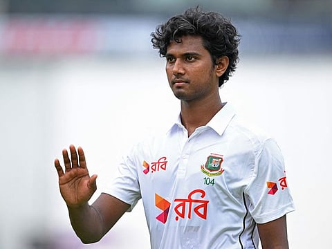 Bangladesh's Hasan Mahmud reacts as he greets supporters during his five-wicket haul in India's first innings in Chennai.