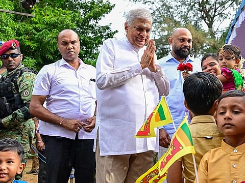Sri Lanka's president and independent presidential candidate Ranil Wickremesinghe (C) greets his supporters during an election rally ahead of the upcoming presidential elections at the Sangilyan Park in Jaffna on September 7, 2024.