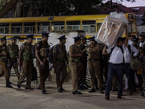 Election officers carry a sealed ballot box to a counting center during the presidential election in Colombo, Sri Lanka, on Saturday, Sept 21, 2024. Sri Lanka's 17 million voters went to the polls Saturday to elect a president two years after an economic meltdown and a historic debt default caused widespread political unrest and the ousting of the former strongman leader.