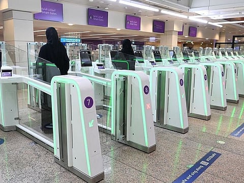 Smart Gates at Dubai International Airport lit up in green - the colour of the Saudi flag - for the occassion