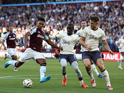 Aston Villa's striker Ollie Watkins (left) challenges Everton's English defender Michael Keane and Everton's Senegalese midfielder Idrissa Gueye (centre) during the English Premier League football match at Villa Park in Birmingham on September 14.