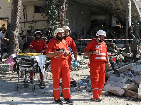 Paramedics arrive at the site of an Israeli strike on the Mount Lebanon village of Maaysra, east of the Christian coastal town of Byblos, on September 25, 2024.