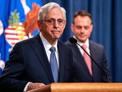 US Attorney General Merrick Garland, joined by Principal Deputy Associate Attorney General Benjamin Mizer, announces that the Department of Justice (DOJ) is suing Visa for monopolising debit markets, during a press conference at the Department of Justice on September 24, 2024 in Washington, DC.
