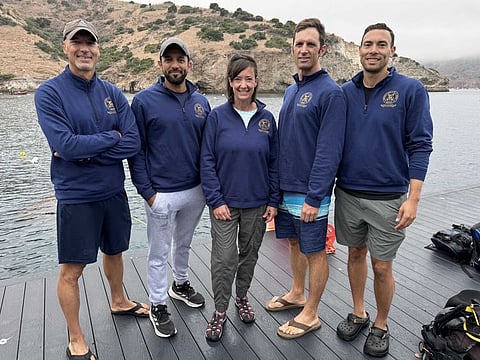 Sultan Al Neyadi with the team at the SEATEST training on moonwalks simulation.