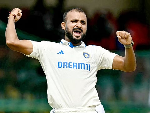 India's Akash Deep celebrates after the dismissal of Bangladesh's Zakir Hasan during the first day of the second Test match at the Green Park Cricket Stadium in Kanpur on September 27, 2024.