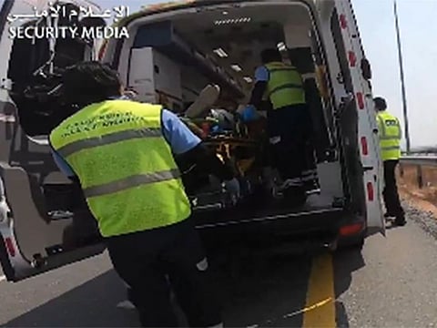 The video shows a helicopter landing and personnel transporting the injured man to a hospital.