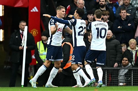 Tottenham Hotspur's Welsh striker Brennan Johnson (centre) celebrates scoring the team's first goal during the English Premier League football match against Manchester United at Old Trafford in Manchester, north west England, on Sunday.