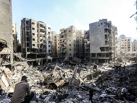 People check the rubble of buildings which were levelled on September 27 by Israeli strikes that targeted and killed Hezbollah leader Hassan Nasrallah in the Haret Hreik neighbourhood of Beirut's southern suburbs, on September 29, 2024.