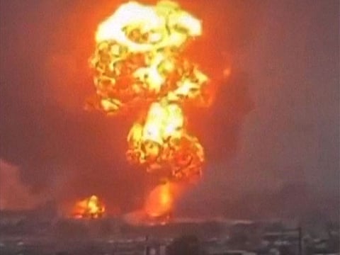 An image grab taken from a UGC video posted on social media on September 29, 2024, shows smoke billowing above Yemen's rebel-held Hodeida port city following Israeli strikes.