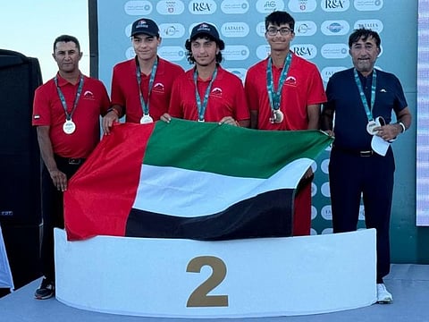 The UAE team celebrate their silver medal