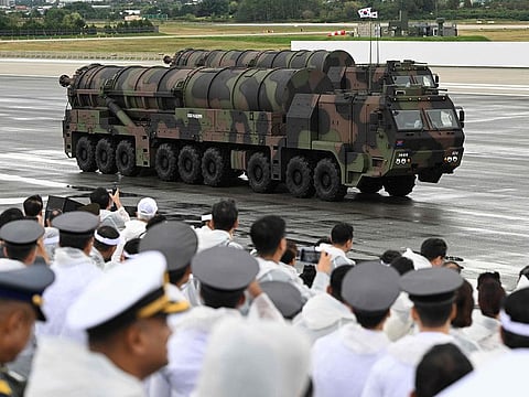 Visitors watch South Korea's Hyunmoo-5 missile during a ceremony to mark the 76th anniversary of Korea Armed Forces Day at Seoul Air Base in Seongnam.