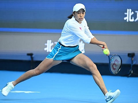 Chinas Zhang Shuai returns to Polands Magdalena Frech during their womens singles match at the China Open tennis tournament in Beijing on Tuesday.
