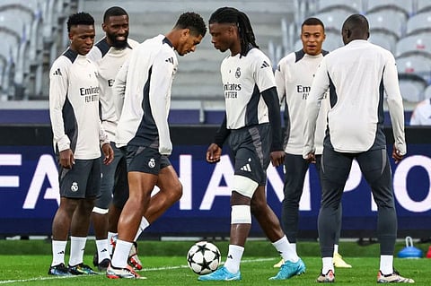 (From left) Real Madrid's Brazilian forward Vinicius Junior, German defender Antonio Ruediger, English midfielder Jude Bellingham, French midfielder Eduardo Camavinga and French forward Kylian Mbappe take part in a training session on the eve of a Uefa Champions League football match against Lille LOSC, at Stade Pierre-Mauroy in Villeneuve-d'Ascq, northern France on Tuesday.