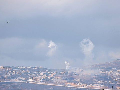 A picture taken from northern Israel along the border with southern Lebanon shows smoke billowing above the Lebanese village of Adaisseh during Israeli bombardment on October 1, 2024.