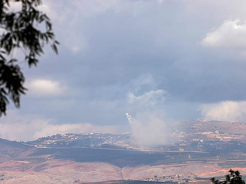 A picture taken from northern Israel along the border with southern Lebanon shows smoke billowing above the Lebanese village of Adaisseh during Israeli bombardment on October 1, 2024.