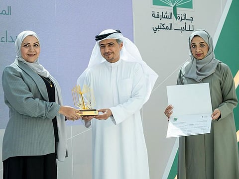 Ahmed bin Rakkad Al Ameri, CEO of the Sharjah Book Authority (SBA), honouring a winner with the Sharjah Libraries' Literature Award