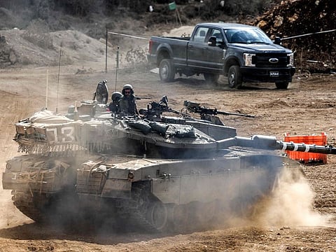An Israeli army main battle tank moves at a position along the border with Lebanon in northern Israel on October 1, 2024.