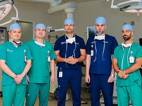 Dr Hussam Ismael, Consultant Surgical Thoracic Oncologist with his team at American Hospital Dubai