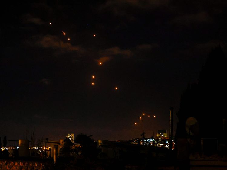 Israel intercepted missiles launched by Iran above Tel Aviv on Tuesday. Air raid sirens sounded in central Israel, the military said, as it launched ground operations into southern Lebanon targeting Hezbollah positions.