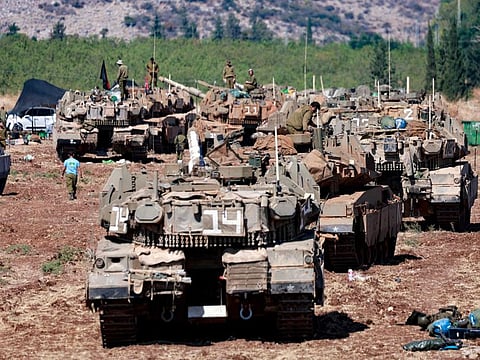 Israeli army tanks are deployed in the Upper Galilee region of northern Israel near the border with Lebanon on September 29, 2024.