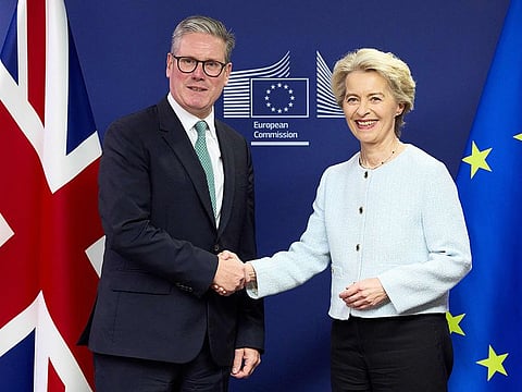 Britain's Prime Minister Keir Starmer shakes hands with European Commission president Ursula von der Leyen (R) at the European Commission headquarters in Brussels on October 2, 2024.