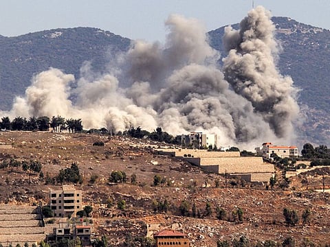 Smoke clouds erupt during an Israeli airstrike on Khiam in southern Lebanon near the border with Israel.