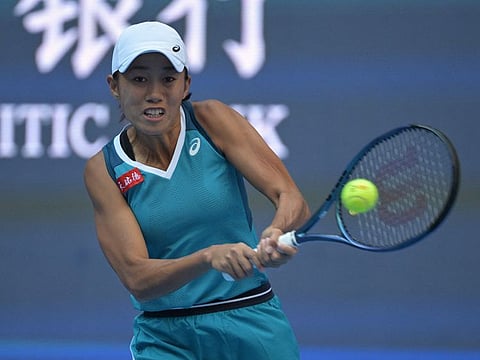 Chinas Zhang Shuai hits a return to Spains Paula Badosa during their women's singles quarter-final match at the China Open tennis tournament in Beijing on Thursday.