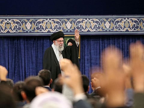 This handout picture provided by the office of Iran's Supreme Leader Ayatollah Ali Khamenei shows him waving to the crowd during a gathering of Iranian top scientific talents in Tehran on October 2, 2024.