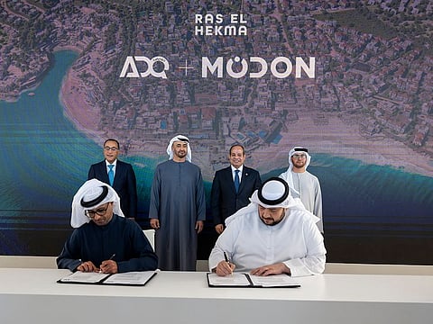 Back row, from left: Mostafa Madbouly, Prime Minister of Egypt; Sheikh Mohamed bin Zayed Al Nahyan, President of the UAE; Abdul Fattah Al Sissi, President of Egypt; Dr Ahmed Mubarak Al Mazrouei, Abu Dhabi Executive Council member and Chairman of the Abu Dhabi Executive Office, witness the signing of Memorandum of Understanding between Abu Dhabi Developmental Holding Company (ADQ) and MODON. Seen signing Jassim Mohamed Buatabh Al Zaabi, Abu Dhabi Executive Council Member Chairman of the Abu Dhabi Department of Finance (front left) and Mohamed Hassan Al Suwaidi, UAE Minister of Investment (front right).