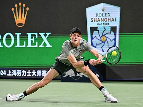 Italy's Jannik Sinner hits a return to Japan's Taro Daniel during their men's singles match at the Shanghai Masters tennis tournament in Shanghai on Saturday.