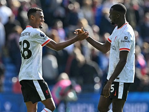 Liverpool's Dutch midfielder Ryan Gravenberch (left) and French defender Ibrahima Konate congratulate each other after the English Premier League football match against Crystal Palace at Selhurst Park in south London on Saturday.