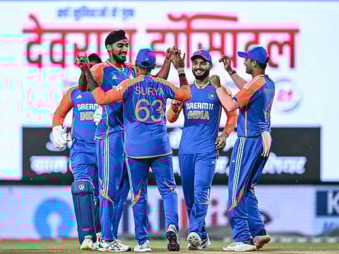 India's Arshdeep Singh (2L) celebrates with teammates after taking the wicket of Bangladesh's Parvez Hossain Emon during the first Twenty20 cricket match at the Shrimant Madhavrao Scindia Cricket Stadium in Gwalior on Sunday.
