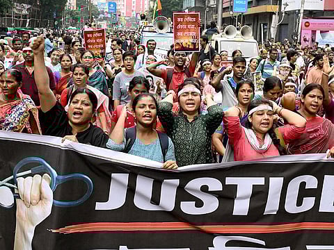 Doctors and social activists carrying a banner, shout slogans during a rally to condemn the rape and murder of a doctor in Kolkata on October 2, 2024.