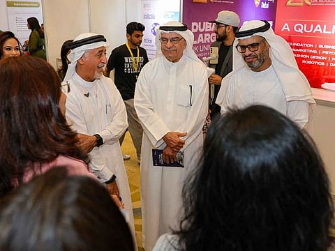 Dr Eesa Al Bastki, President of University of Dubai; Abdul Hamid Ahmad, CEO and Editor-in-Chief of Gulf News; and AlMehdar Ahmed, Head of Higher Education Classification & Rating Framework at KHDA; interacting with exhibitors at Gulf News Edufair