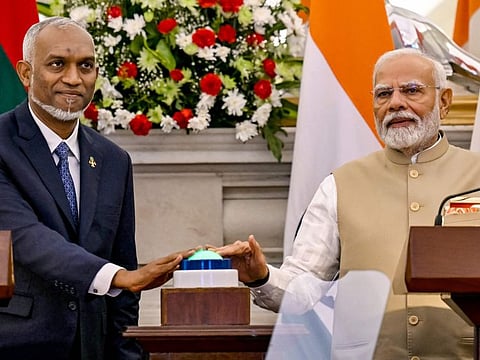 India's Prime Minister Narendra Modi (right) and Maldives President Mohamed Muizzu virtually inaugurate the new runway at Maldives' Hanimadhoo International Airport, during a joint media briefing at the Hyderabad House in New Delhi on October 7, 2024.