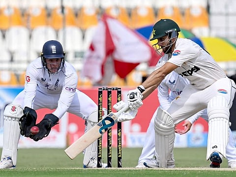 Pakistan's Agha Salman (right) plays a shot as England's wicketkeeper Jamie Smith watches during the second day of the first Test in Multan on Tuesday.