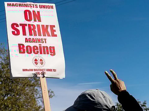 File photo: A worker pickets outside the Boeing Co. manufacturing facility during a strike in Renton, Washington, US, on October 3, 2024.