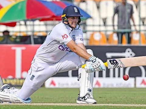 England's Joe Root plays a reverse sweep during his century on the third day of the first Test against Pakistan in Multan.