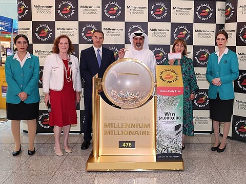 DDF representatives with the million-dollar ticket at the draw at Dubai International Airport on Wednesday