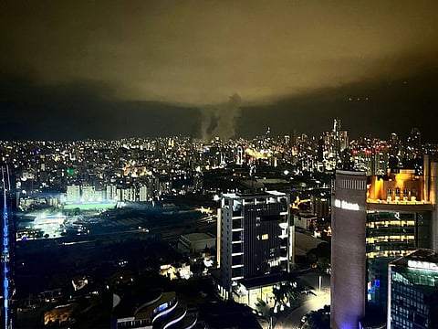 Smoke plumes rise from the site of two Israeli airstrikes on a neighbourhood in Beirut.