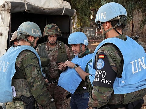 Spanish peacekeepers of the United Nations Interim Force in Lebanon (UNIFIL) coordinate their patrol with the Lebanese army, in Marjayoun in south Lebanon on October 8, 2024.