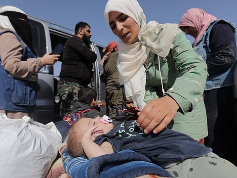 Syrians who were refugees in Lebanon return to their home country after a journey to the opposition held northern Idlib province through the crossing Aoun Al Dadat north of Manbij, on October 9, 2024.
