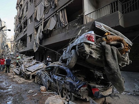 Wrecked cars sit at the site of an Israeli air strike in the Basta area, in Beirut, on October 11, 2024, amid the ongoing war between Israel and Hezbollah.