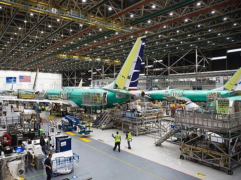 File photo: Employees work on Boeing 737 MAX airplanes at the Boeing Renton Factory in Renton, Washington.