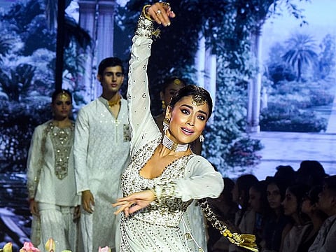 Actress Shriya Saran performs during the Lakme Fashion Week, at Grand Hotel in New Delhi on Friday
