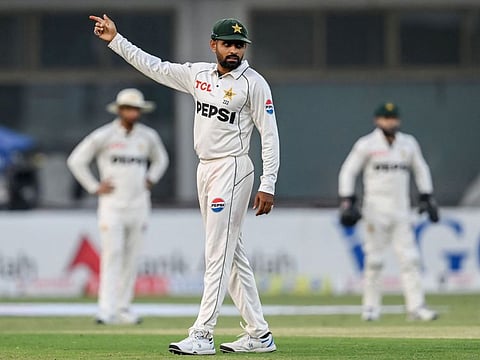 Pakistan's Babar Azam gestures during the second day of the first Test cricket match against England at the Multan Cricket Stadium in Multan on October 8.