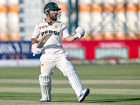 Pakistan's Kamran Ghulam celebrates after scoring a century during the first day of the second Test cricket match against England at the Multan Cricket Stadium in Multan on Tuesday.